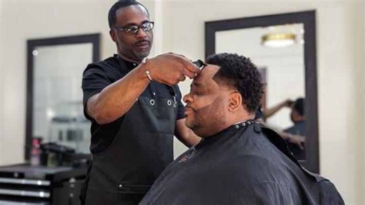 How do barbershop owners pay themselves?