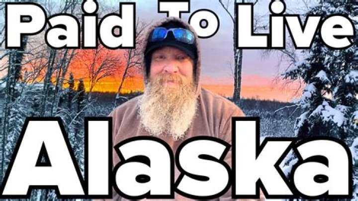 How long do you have to be a resident of Alaska to get paid to live there?